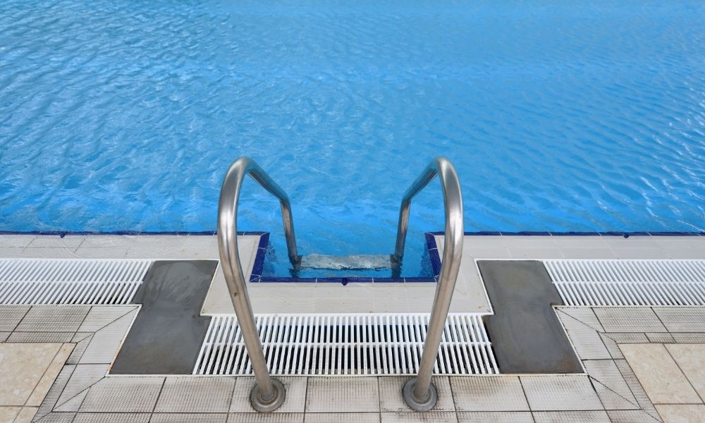 use a handrail as part of the ideas to renovate inground pools