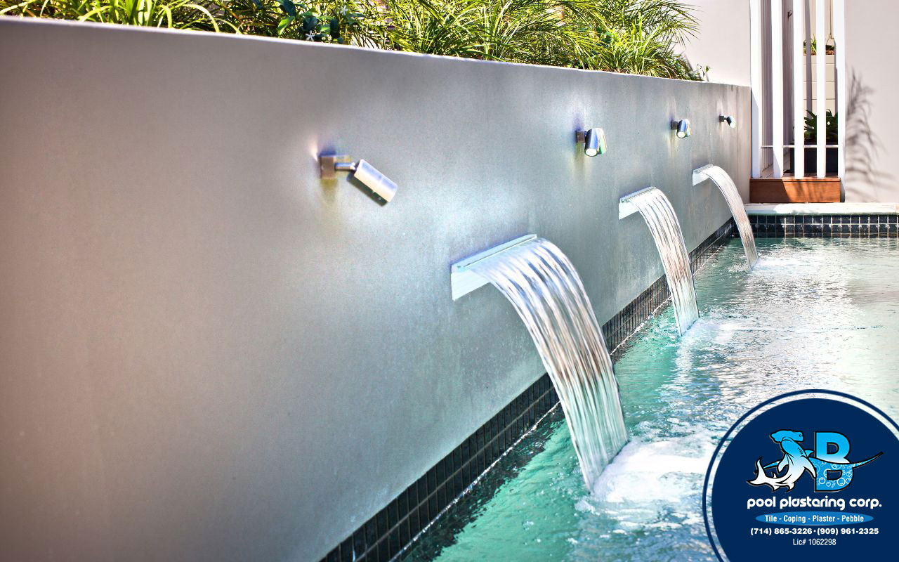 Modern features in a renovated pool with LED lighting and automated systems.